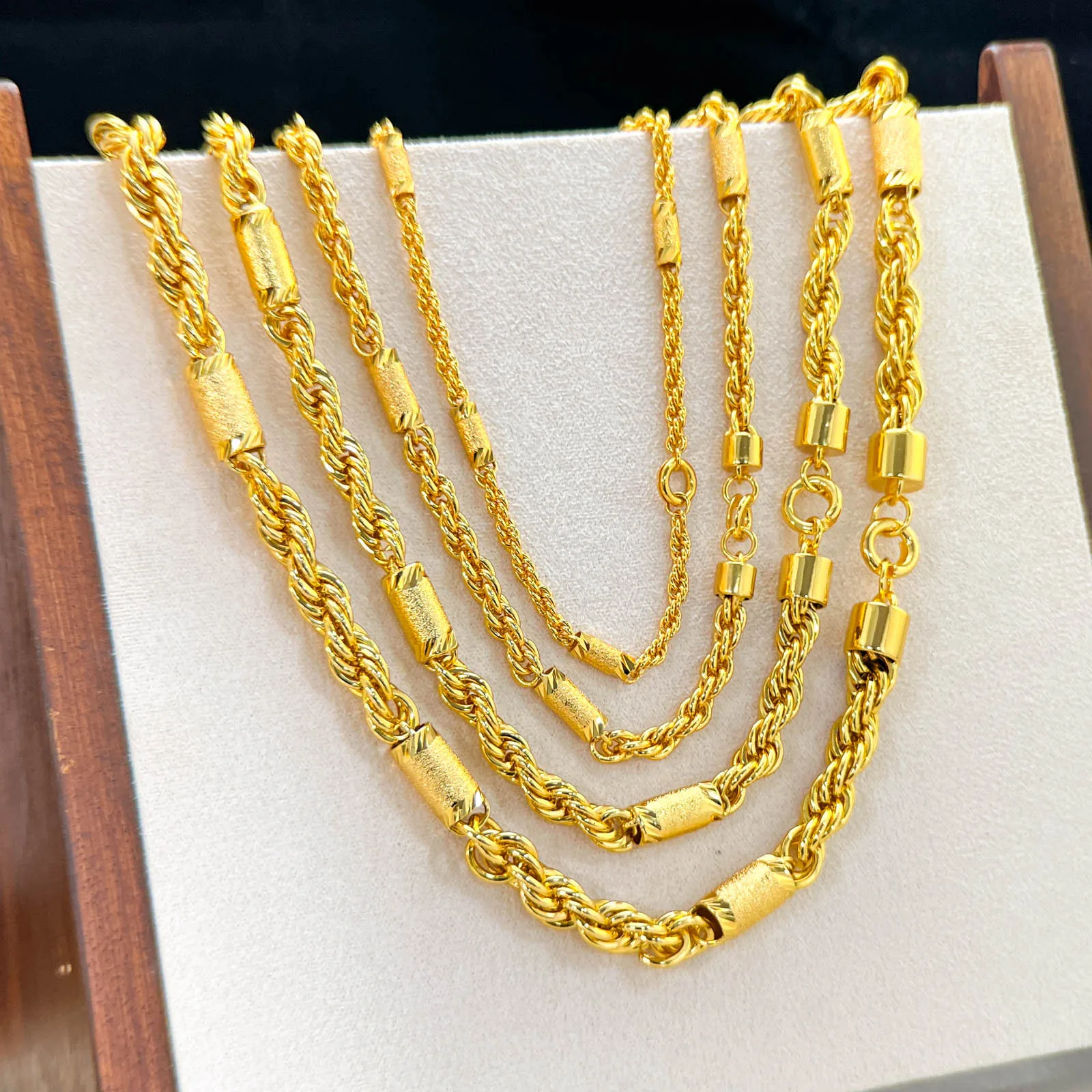 Artisan craftsmanship fabricates Cylinder Twist Necklace for men and women out of premium 24K Gold with AU999 high purity