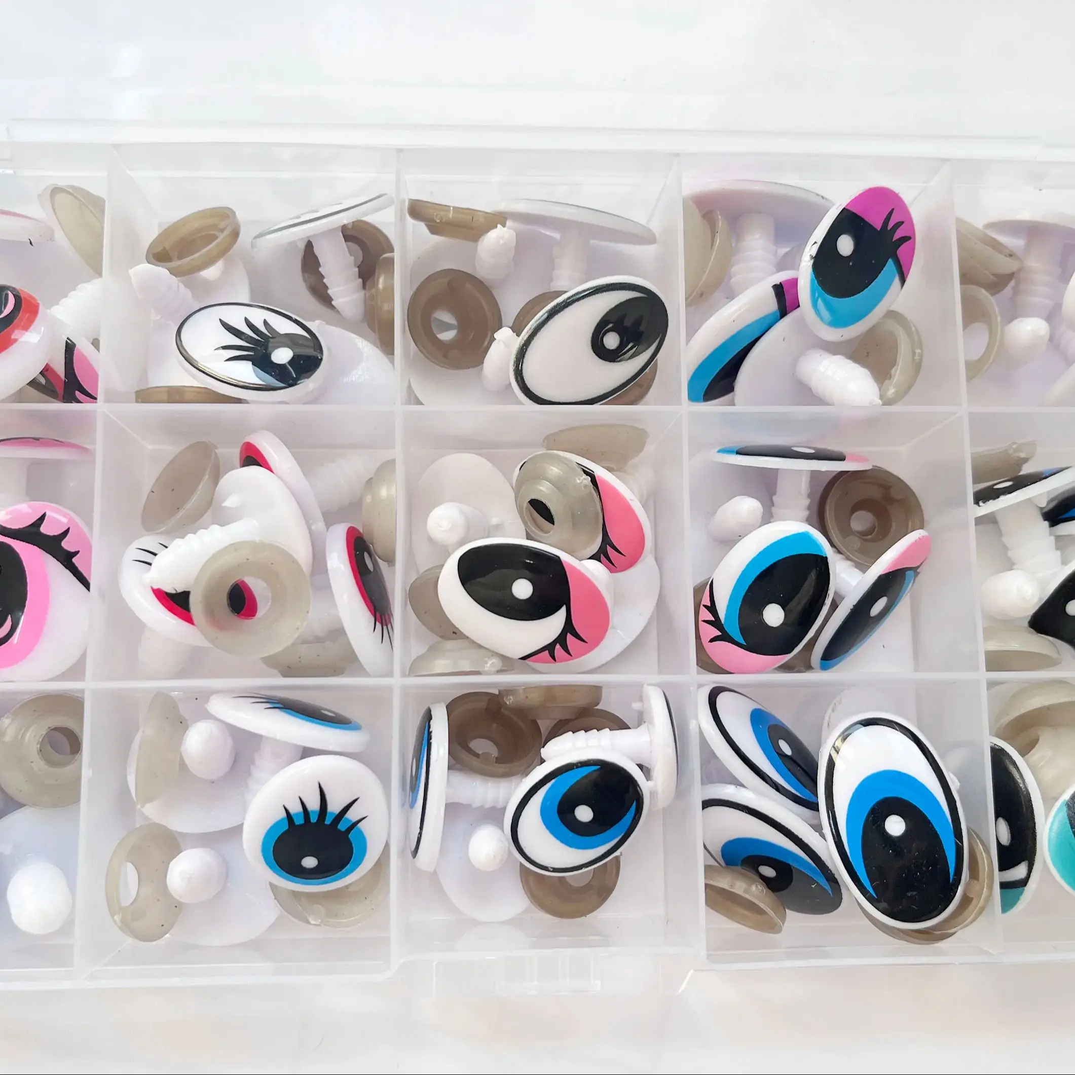 60 Stück/Box 15 verschiedene Stile Cartoon-Sicherheitsaugen aus Kunststoff mit weicher Unterlegscheibe für DIY-Plüschtier-Bastelbedarf – Detail 2