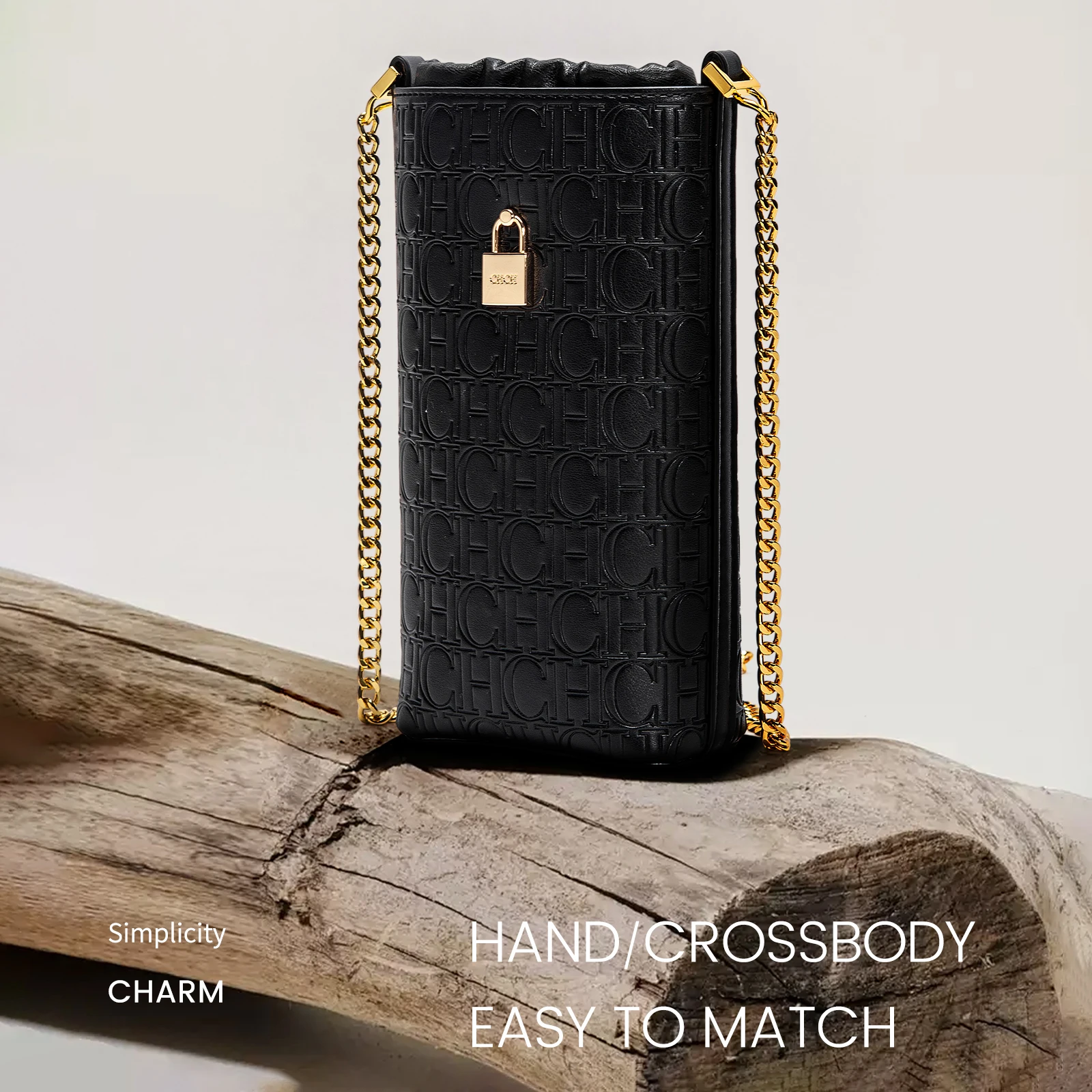 レザー ショルダー バッグエンボス モチーフヴィンテージ風のデザイン、ゴールド調のロック、テクスチャード チェーン、シックな機能的なディテール