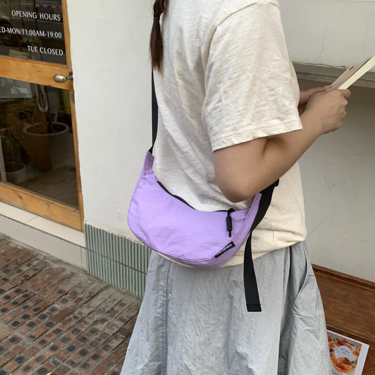Women's Pastel Purple Nylon Half Moon Sling Bag with Black Strap and Logo Tag Casual Crossbody Shoulder Purse for Daily