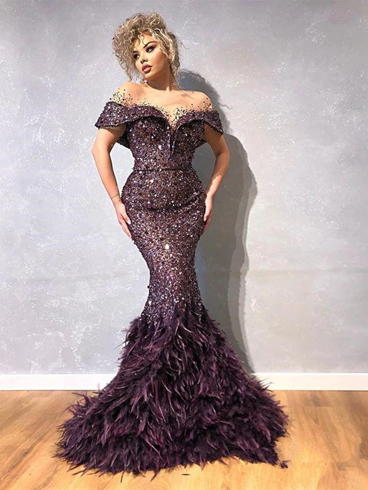 

Glitter Mermaid Evening Dress Sheer Jewel Neck Sequins Feather Long Prom Gowns Capped Short Sleeves Sweep Train Party Dresses