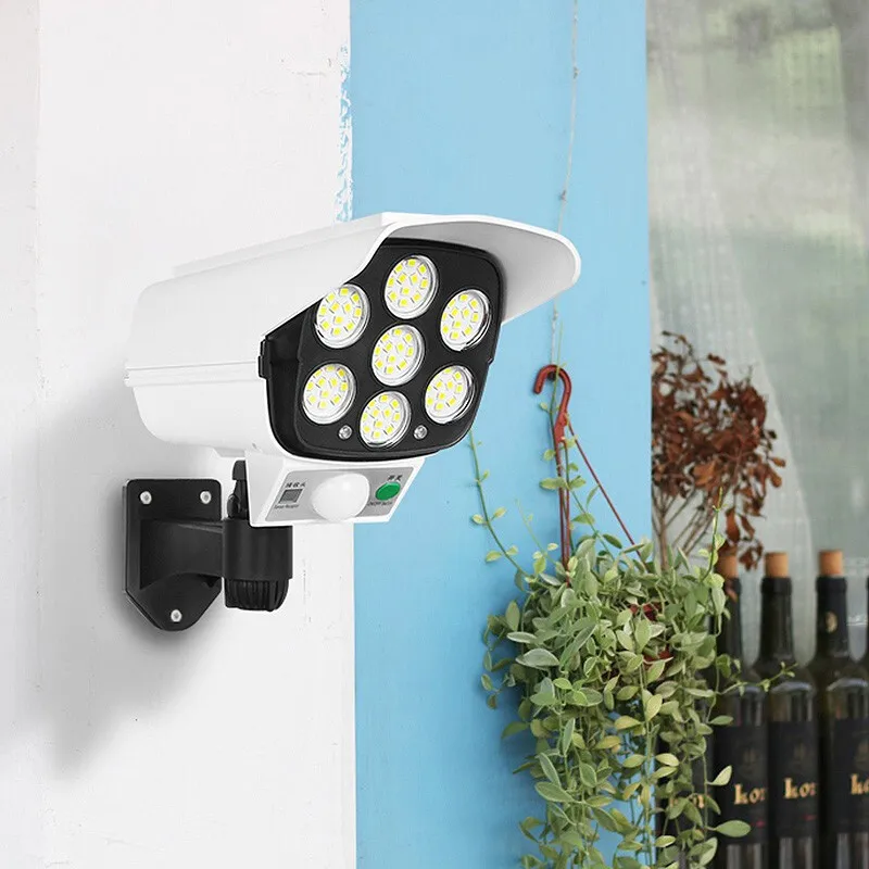 Luz Solar LED con Sensor de movimiento, cámara de seguridad falsa inalámbrica, luz de inundación al aire libre, lámpara impermeable IP65, 3 modos