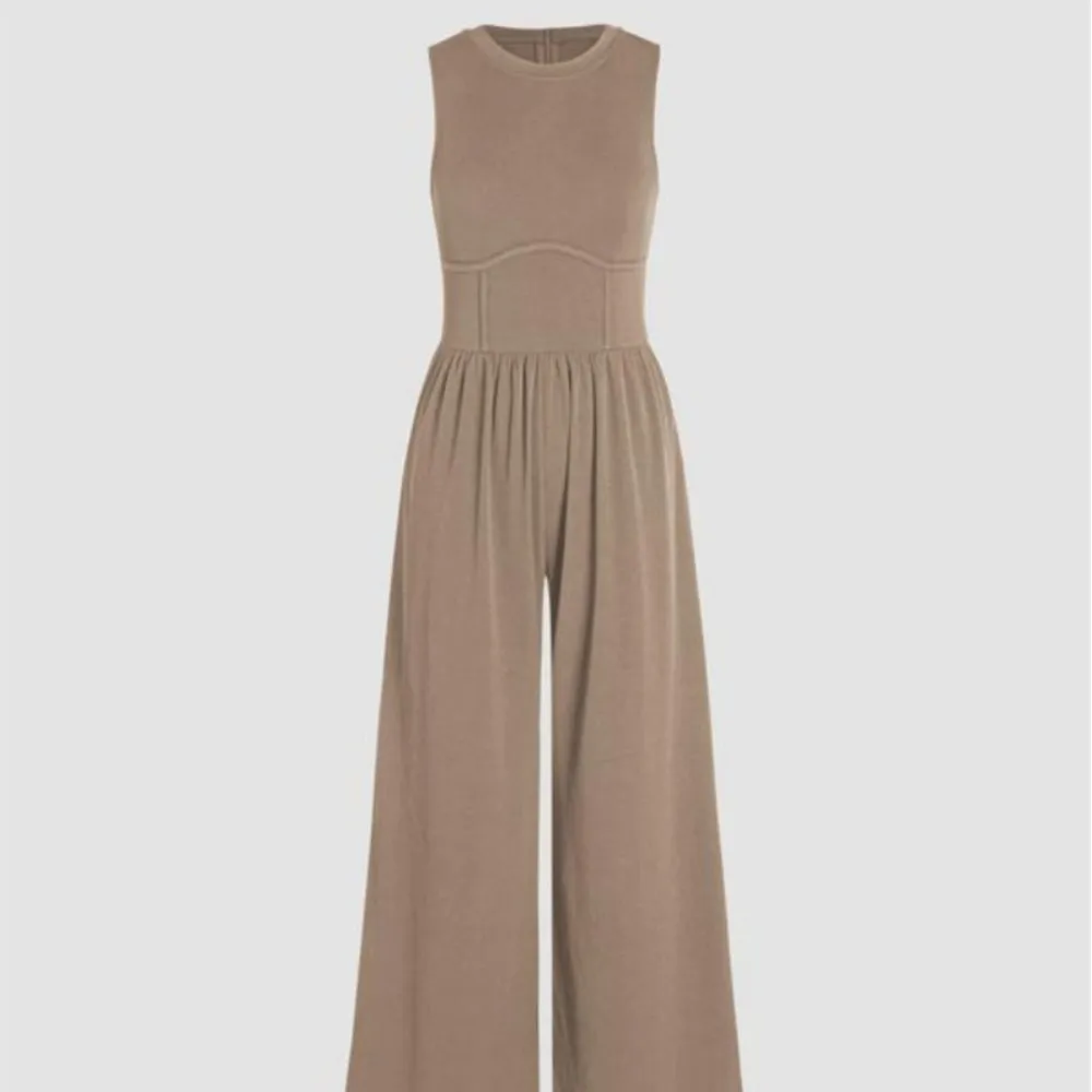 ملابس نسائية بذلة نحيفة عالية الخصر ورقبة دائرية وأرجل واسعة بدلة قفز للمرأة بلون سادة أنيقة بدون أكمام للتنقل