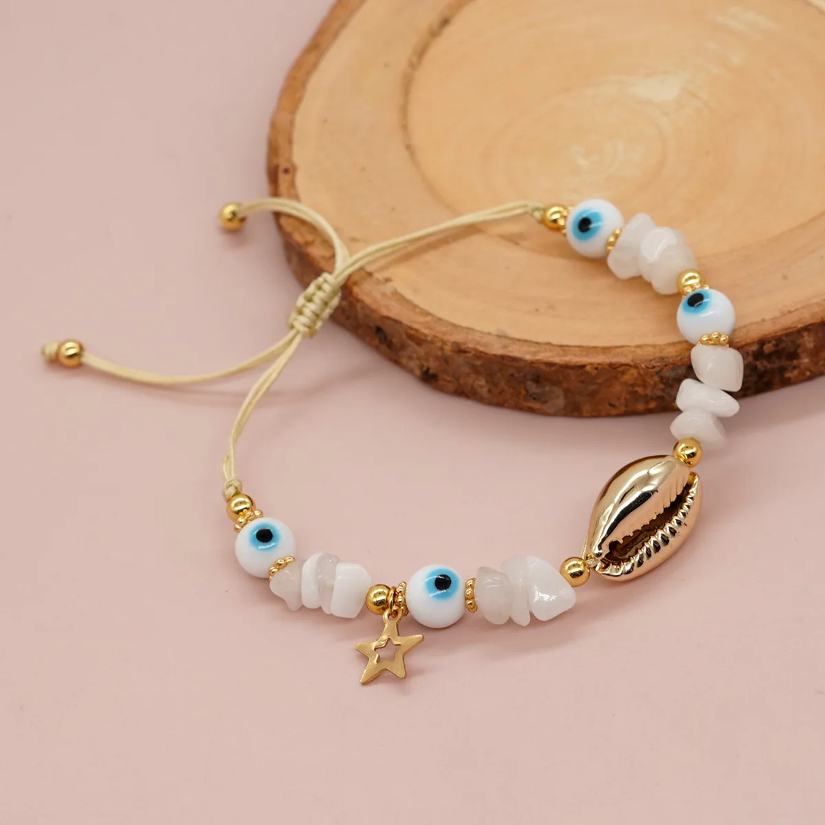 Cross border Bohemian style white glazed eyes, golden snowflake flakes, white jade, golden shell beads, women's bracelet