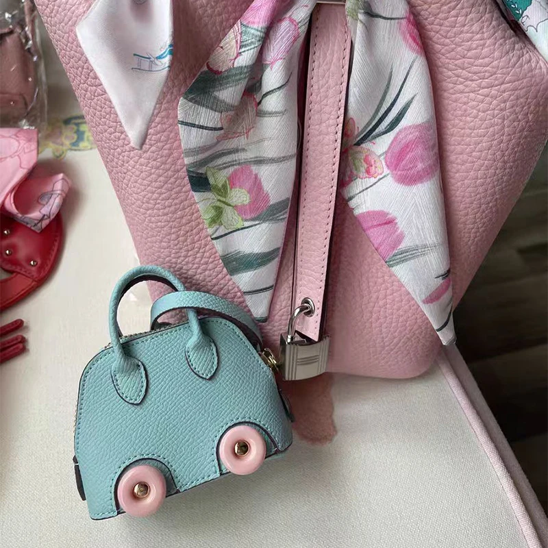 Mini lindo bolso de concha de rueda colgante lindo lápiz labial bolsa para auriculares accesorios bolso de bolos colgante colgante de coche Corea del Sur nuevo caliente