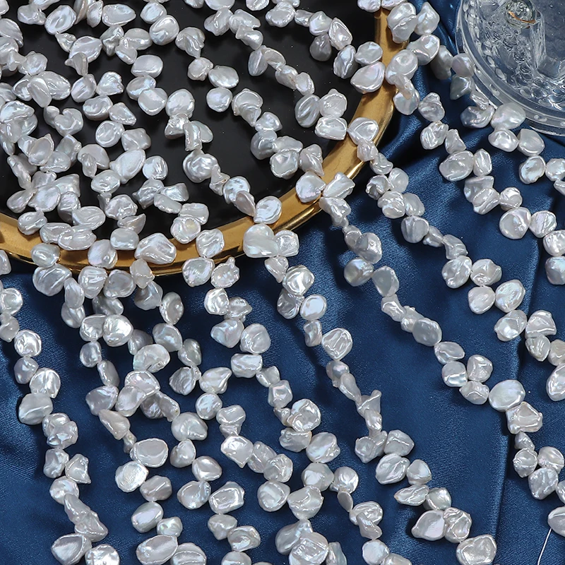 A strand of 6-7mm cold-light Sanqi petal freshwater regenerated beads, approximately 38cm long, containing over 70 beads.