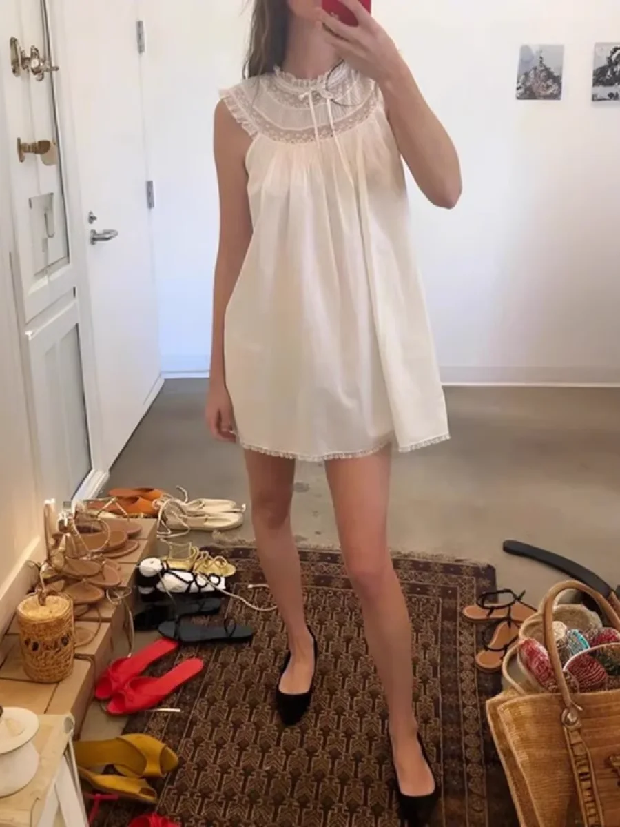 

2025 New Women White Cotton Doll Dress Lace Embroidery Patchwork Round Neck Sleeveless Casual Loose Mini Robe