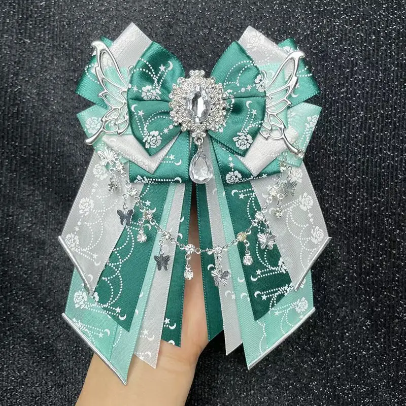 オリジナル手作りゴージャスなロリータ弓天使の羽アニメアニメーションコンサートアクセサリー女性のシャツデラックスラインストーンブローチ