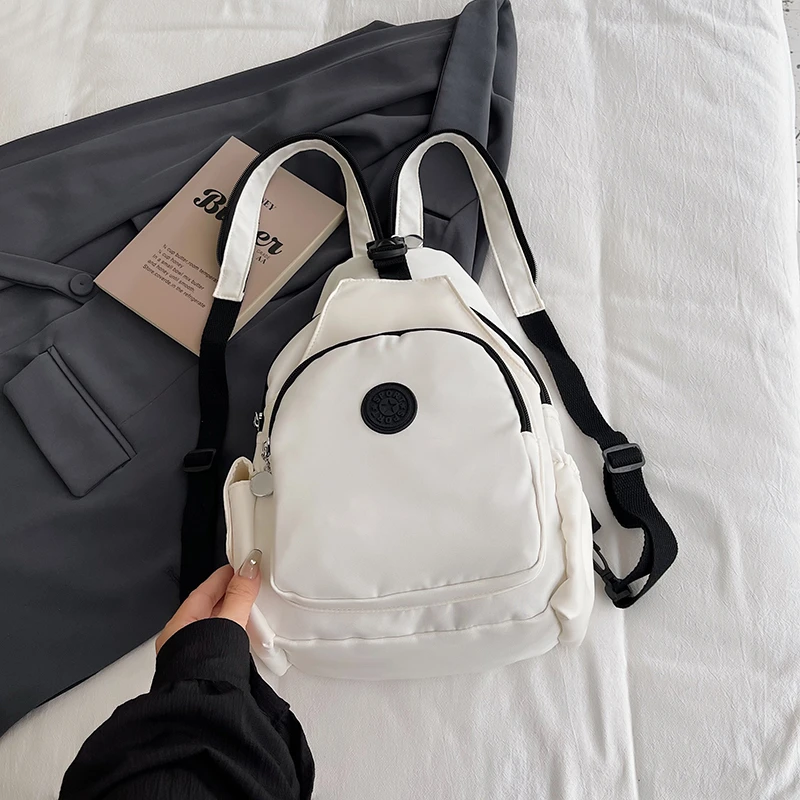 

Женский рюкзак, хит продаж, нейлоновая ткань, легкий, большой вместимости, для путешествий на открытом воздухе, высокое эстетичное значение.