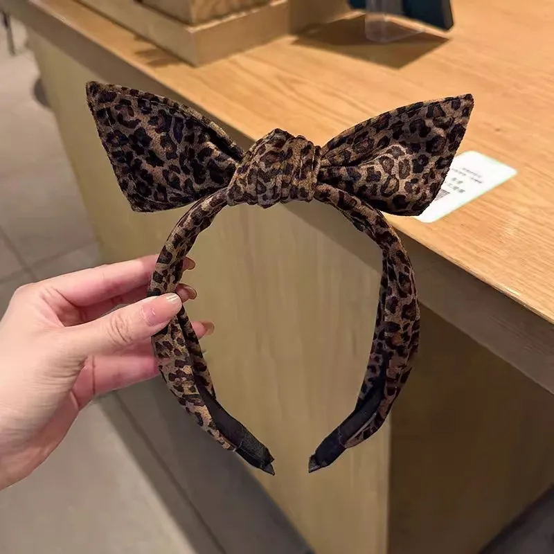 

Leopard print three-dimensional bow headband women's 2025 new high cranial top hair pressure hairpin wash face headband fashion