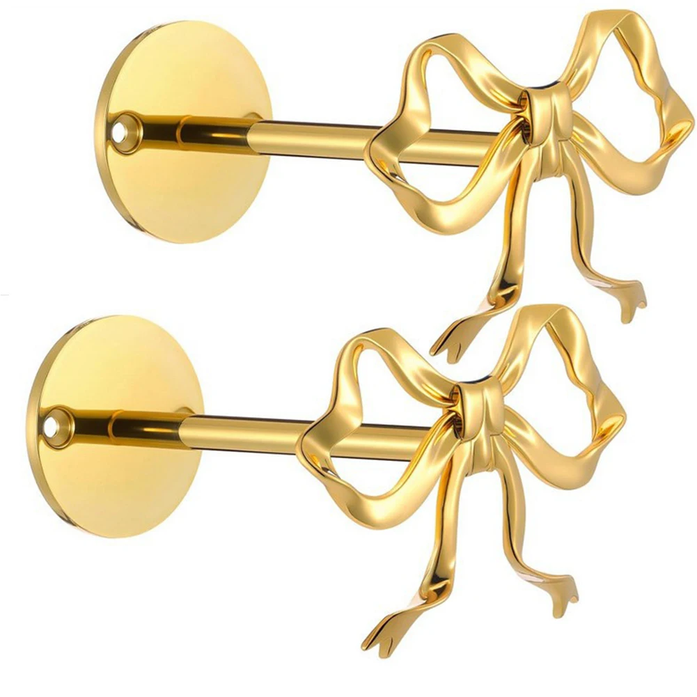 Gold bow wall mount curtain holdbacks for interior styling metal tieback hardware supporting full-length curtains and valances