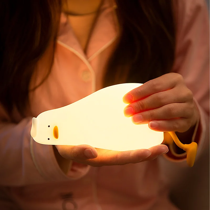 Lying Flat Duck Night Light Silicone Squishy Rechargeable Tap Control 3 Brightness 30 Min Timer Phone Holder for Bedside view 2
