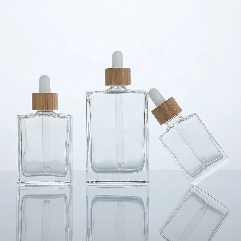 

Square Clear 30ml 50ml 100ml Essential Oil Rectangle Glass Dropper Bottles with Pipette bamboo top Cap 15ml 1 oz