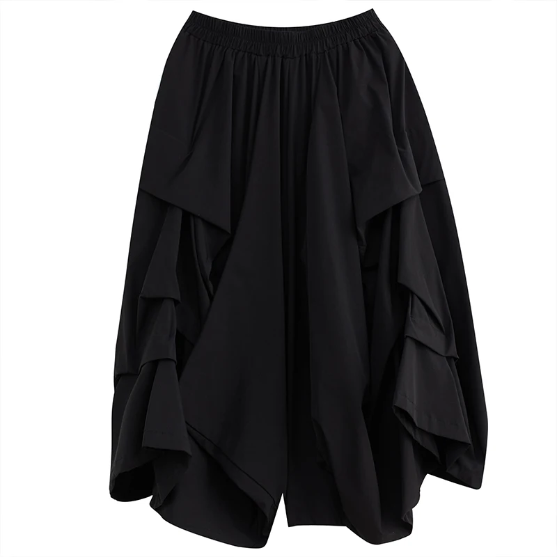 Szerokie spodnie z szerokimi nogawkami, elastyczna talia, plisowana spódnica codzienna, modna, uniwersalna, dobra jakość, możliwość warstwowego noszenia, styl do pracy.