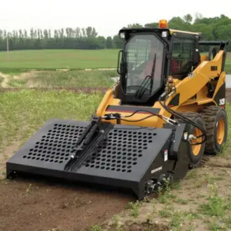 Skid steer loader attachment landscape rake