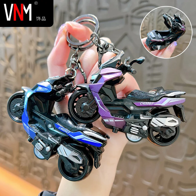 Creative alloy rebound motorcycle keychain simulation pedal toy car model keychain pendant gift