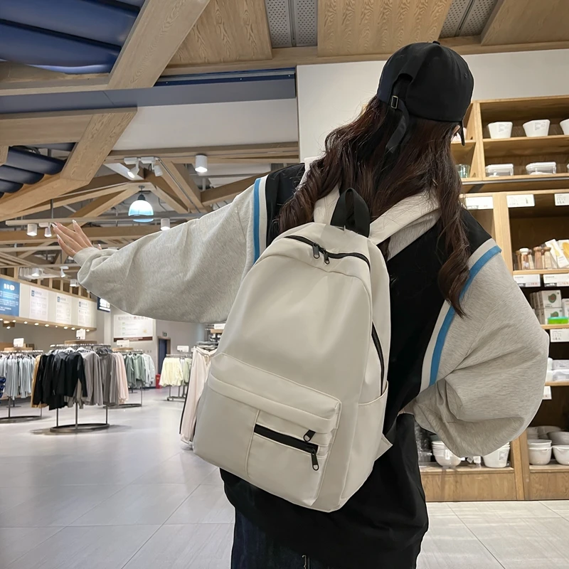 シンプルなソリッドカラーのカジュアルバックパック、軽量で多用途な高校生バッグ、ハンギングアウト用の多用途なソリッドカラーのデイパック