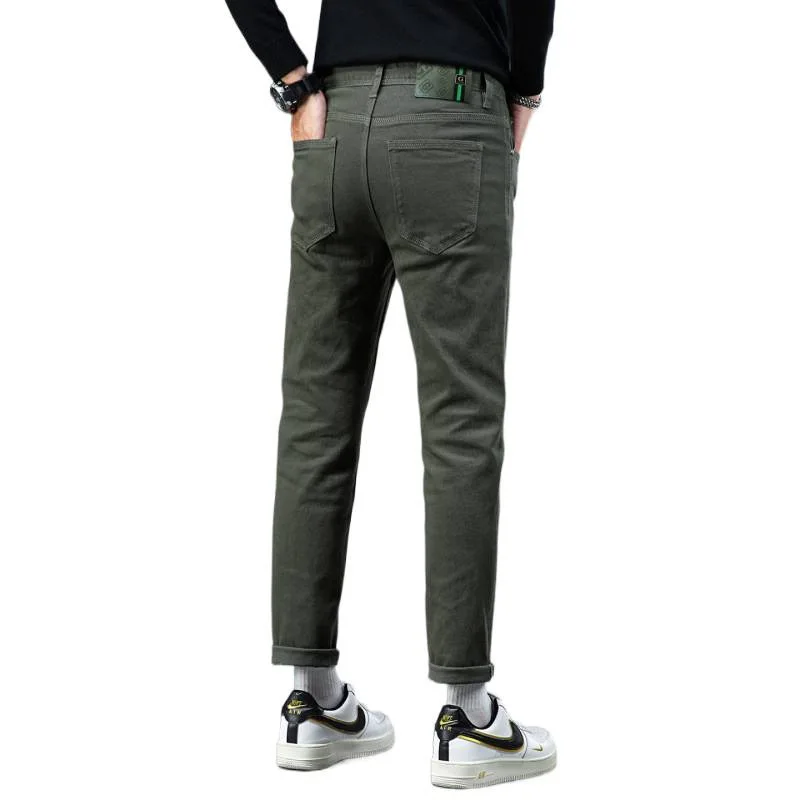 Vaqueros sencillos y lujosos para hombre en otoño de 2025, con ajuste elástico y pantalones casuales de negocios urbanos de alta gama