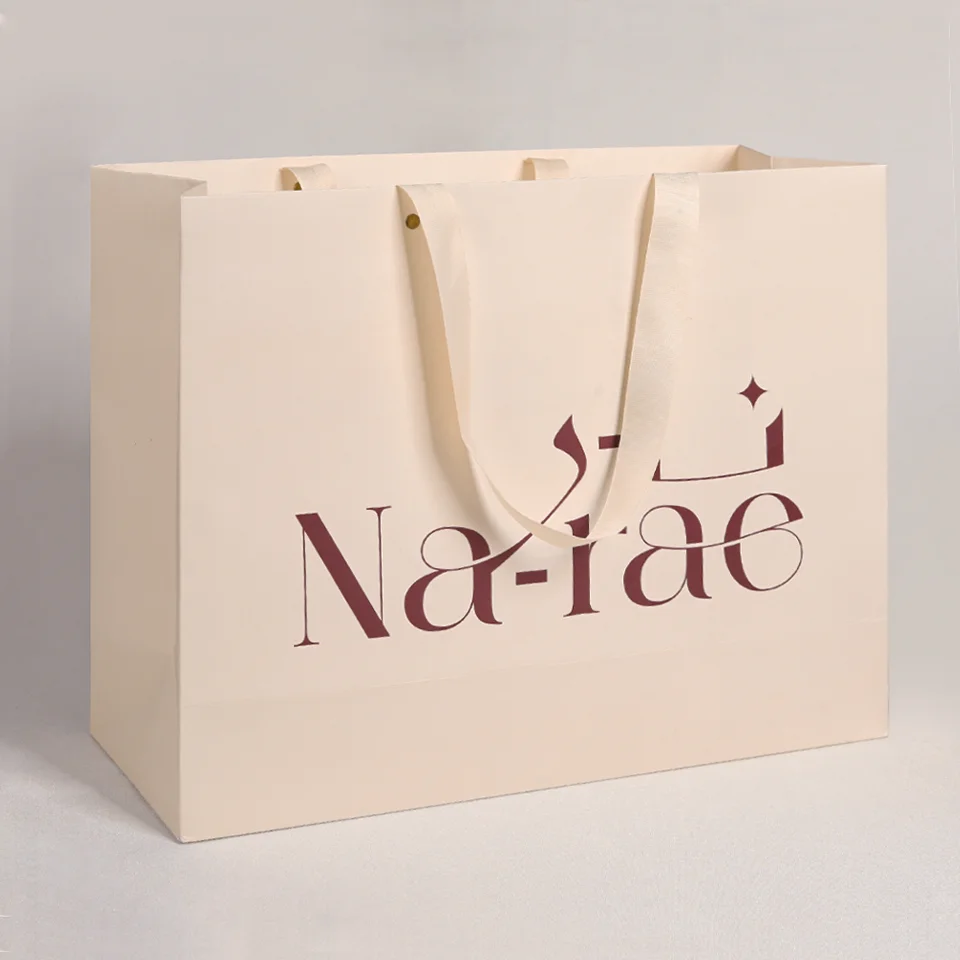 Custom Recycled  Luxury Cream Beige Shopping Paper Bags With Your Own Logo Ivory Clothes Packaging Gift Bag With Ribbon Handle