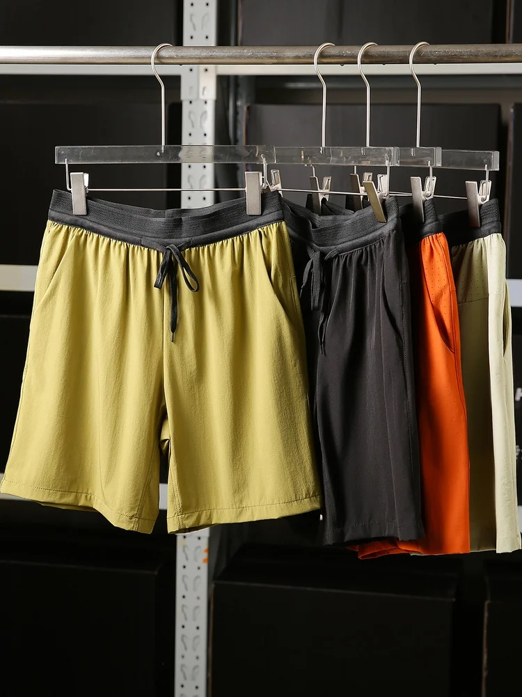 

Мужские спортивные брюки длиной до колена с лазерной перфорацией, эластичные, дышащие, быстросохнущие, для комплексных тренировок на открытом воздухе, летние.