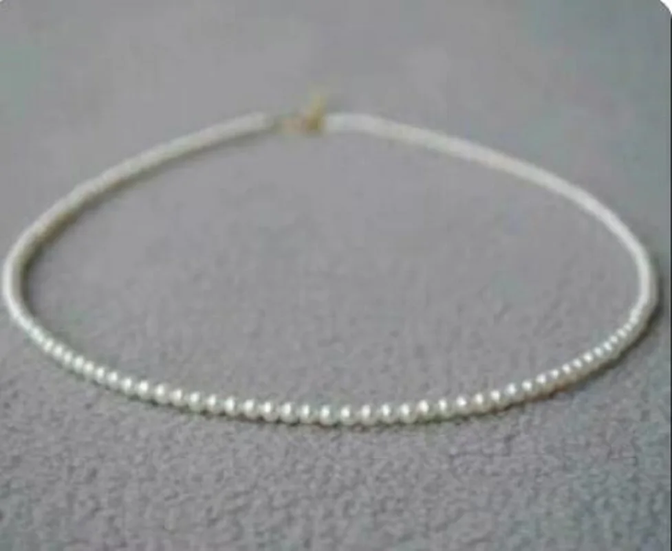 

Fashion Jewelry Mini 18-inch AAAA+5-6mm white pearl necklace with 14K gold chain.