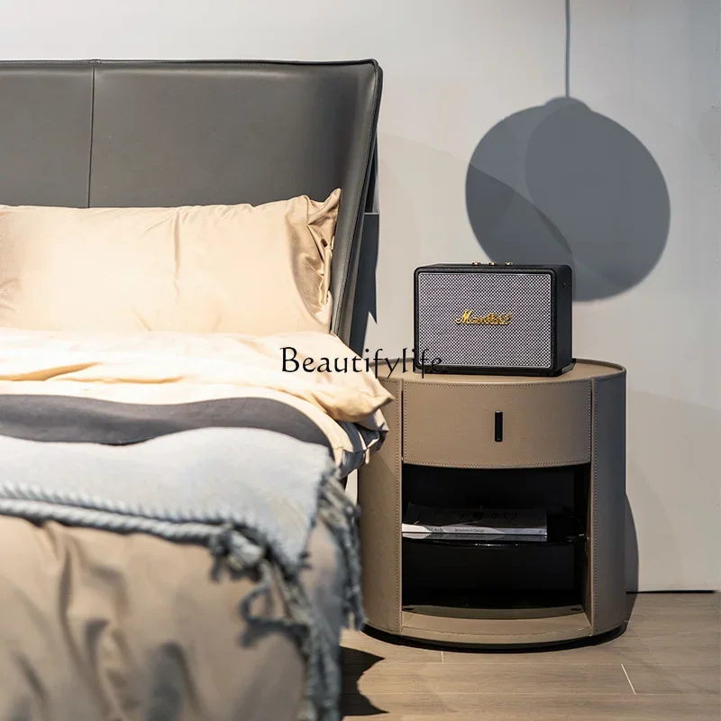 

Italian light luxury round saddle leather bedside table, high-end bedroom bedside table