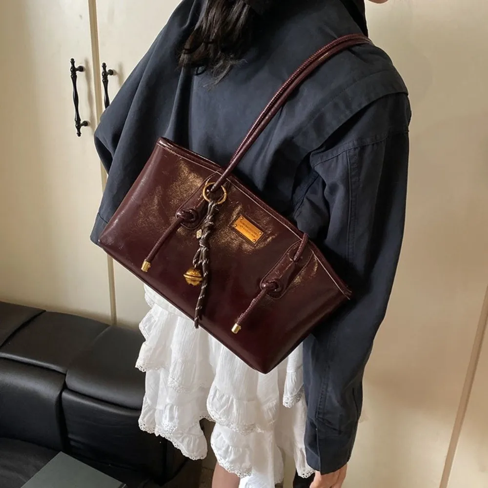 Vintage Large Capacity PU Shoulder Bag Solid Color Soft Underarm Handbag Decorative Bell Charm Knotted Strap Work Tote Women