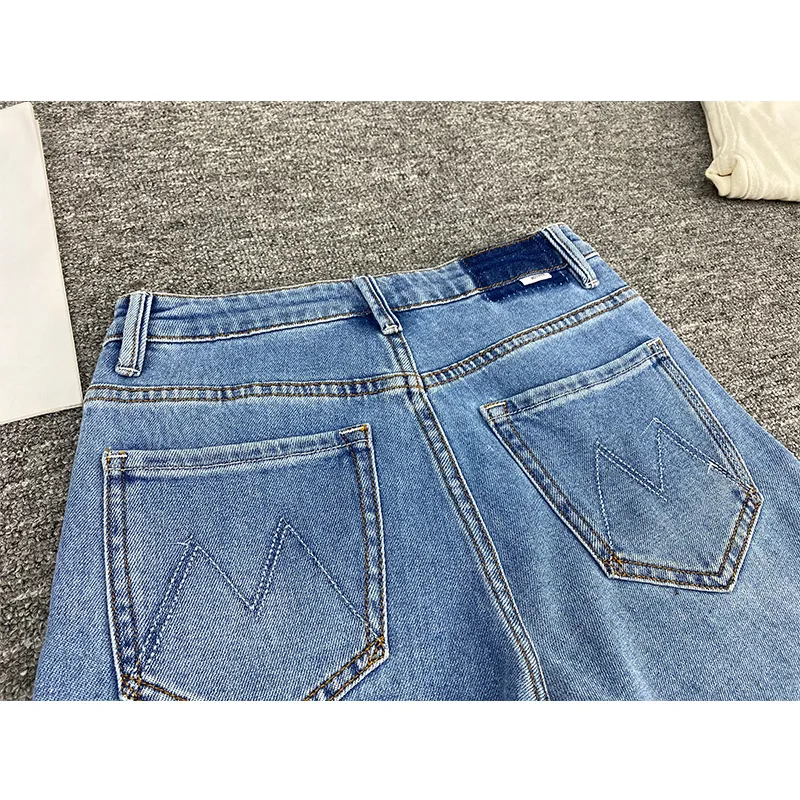 Pantaloni da donna elasticizzati retrò slim in denim dritto con versatili pantaloni in denim arruffato blu morbido