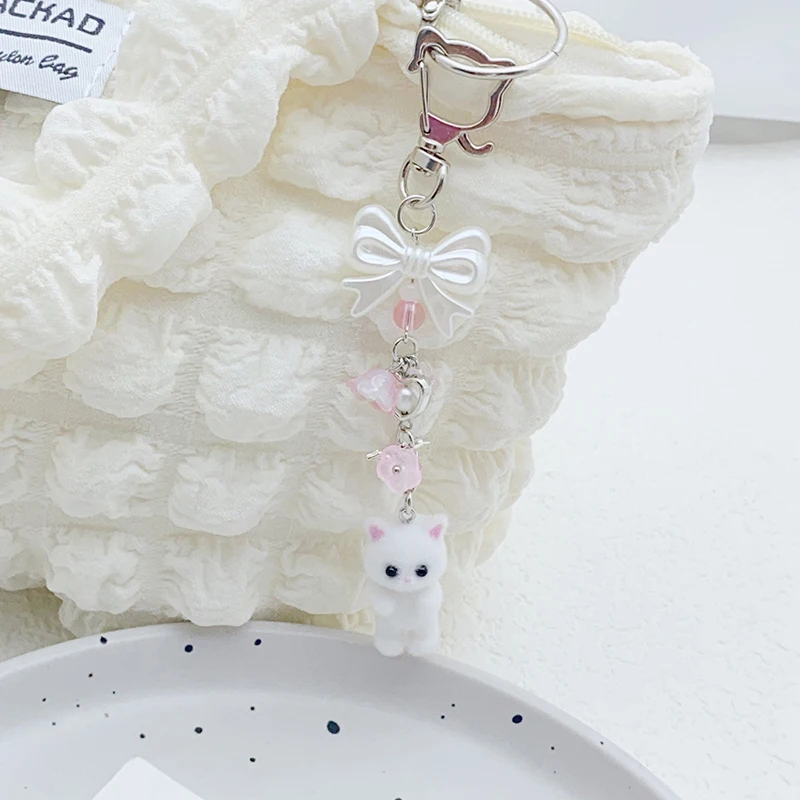 1PC Auto Schlüssel Halter Beflockung Katze Schlüsselring Bowknot Kleine Blume Perle Anhänger Telefon Lanyard Tier Schlüssel Kette Charme Zubehör