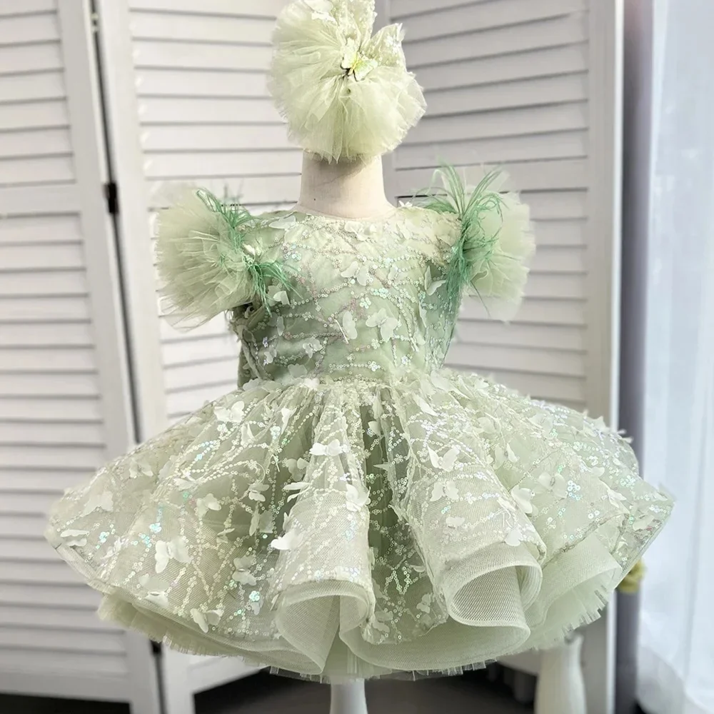 custom-flower-girl-dress-for-wedding-first-christmas-party-with-feather-accented-puff-sleeves-butterfly-embellished-tulle-skirt