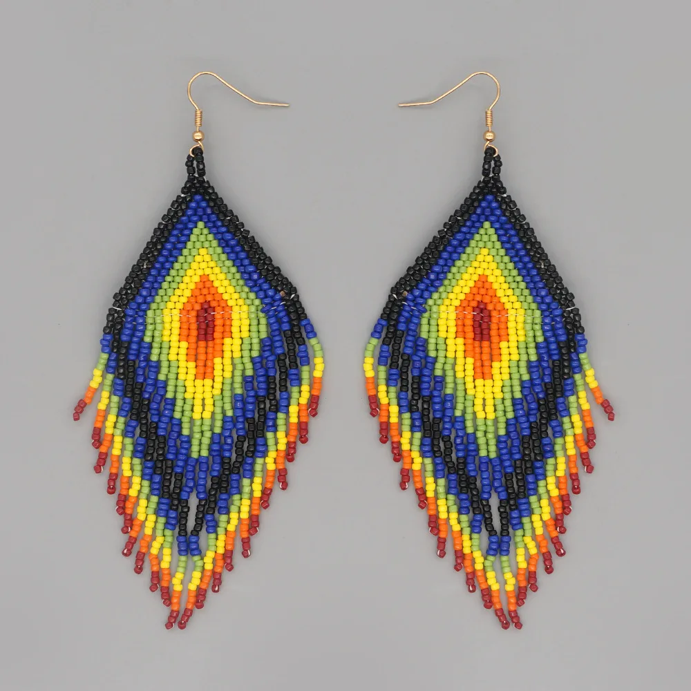 

Beaded earrings Tassel Originality Design Devil's eye Hand knitting Bohemia Alloy Tide Simple Female Rice bead earrings