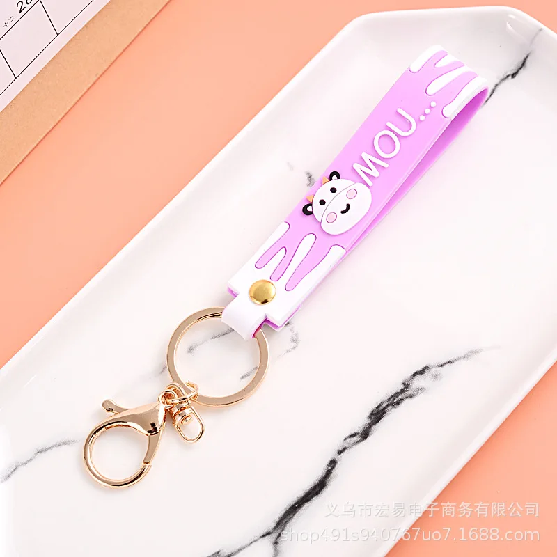 New exquisite magic color leather cord keychain golden doll cow leather cord lobster clasp pendant