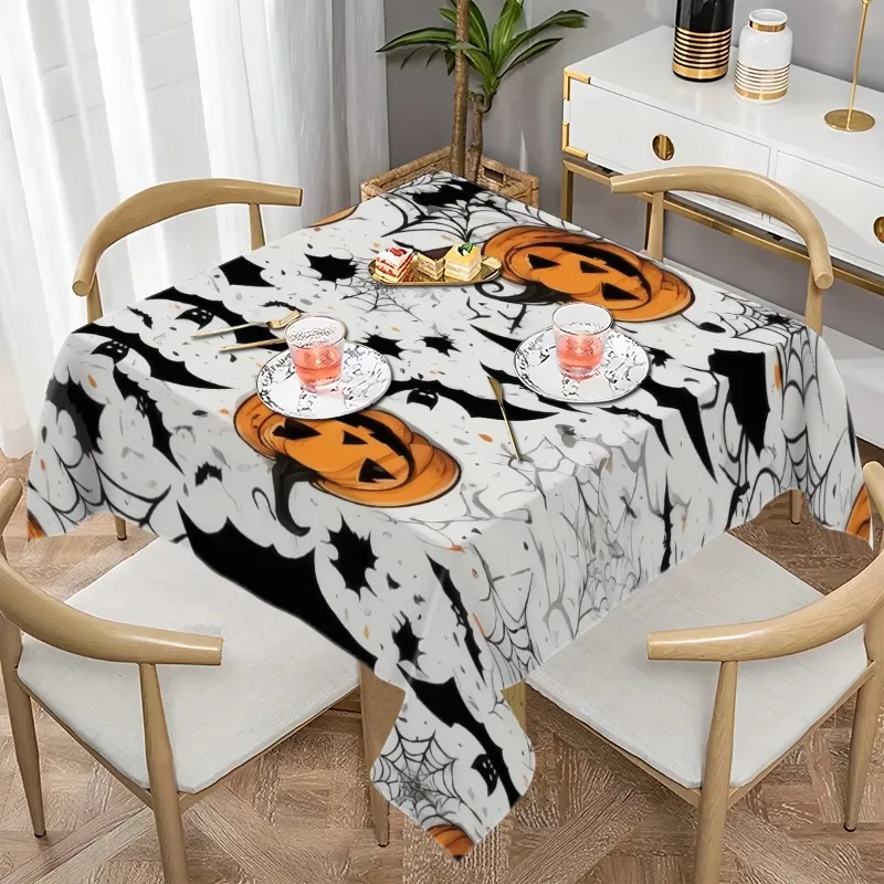 A single piece of a terrifyingly colorful orange, black and white patterned pumpkin, with bat and spider web designs