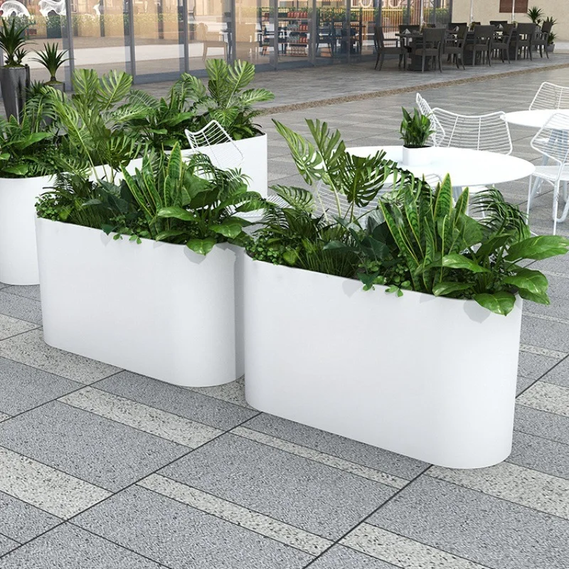 Outdoors, street displays include stainless steel flower beds and curved flower beds