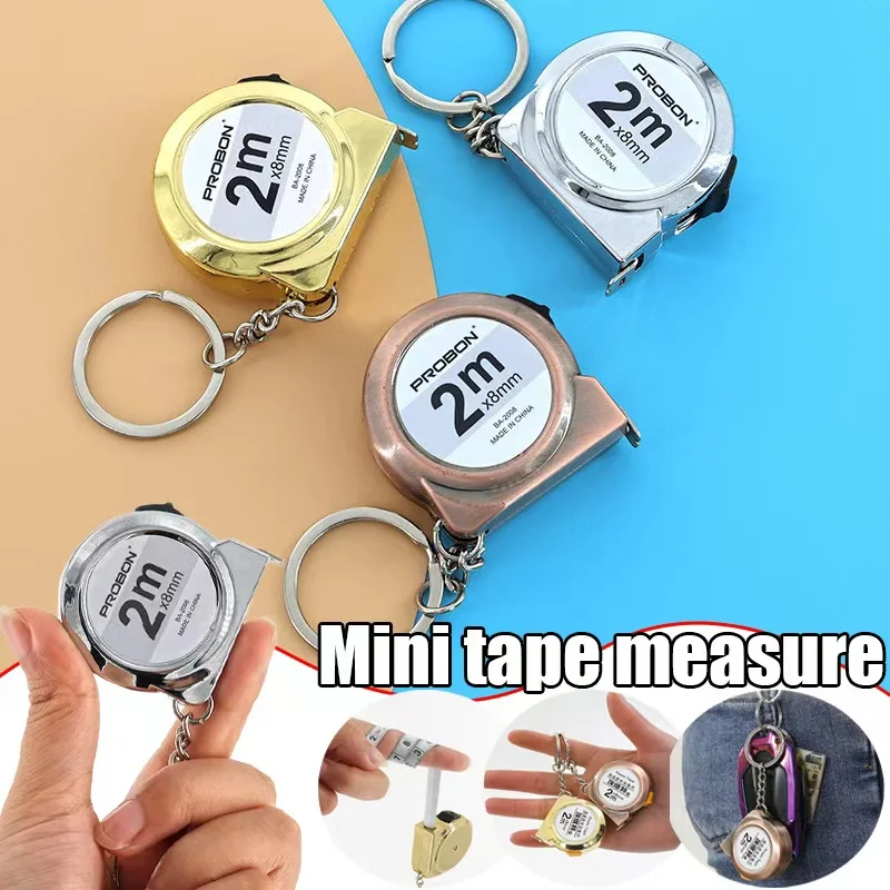 شريط قياس صغير محمول، شريط قياس منزلي صغير قابل للسحب 2 متر، شريط قياس سلسلة مفاتيح من الفولاذ المطيء، أدوات قياس ذاتية الصنع #1