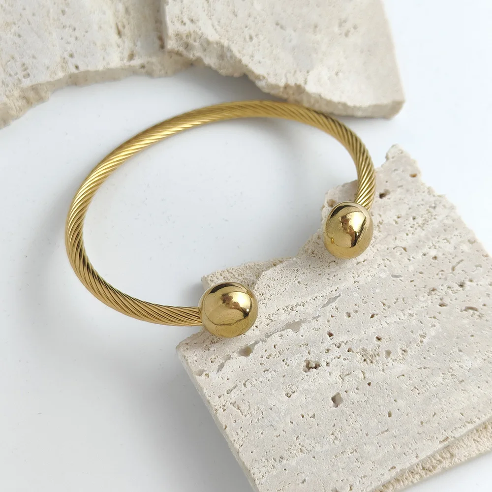Double ball gold-plated stainless steel bracelet, twisted steel wire C-shaped design, classic fashion jewelry