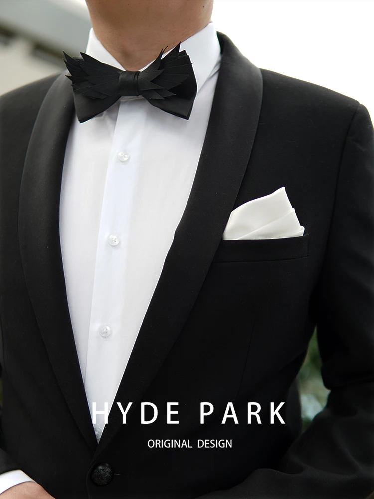 Banquet host with a luxurious black bow tie, wedding groom bow tie, and floral collar