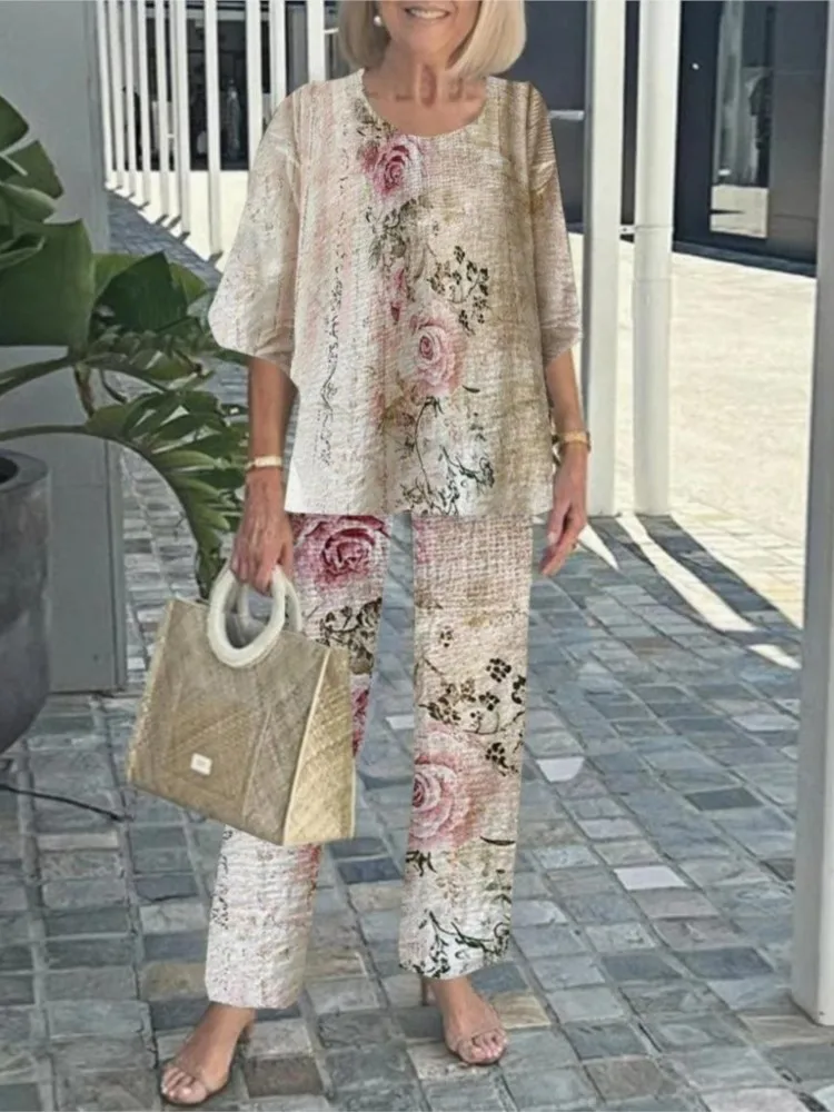 夏の新 2 点セット女性の O ネック 3/4 袖プリントパンツスーツカジュアルルーズ不規則なトップ + ワイドレッグパンツ 2 点セット