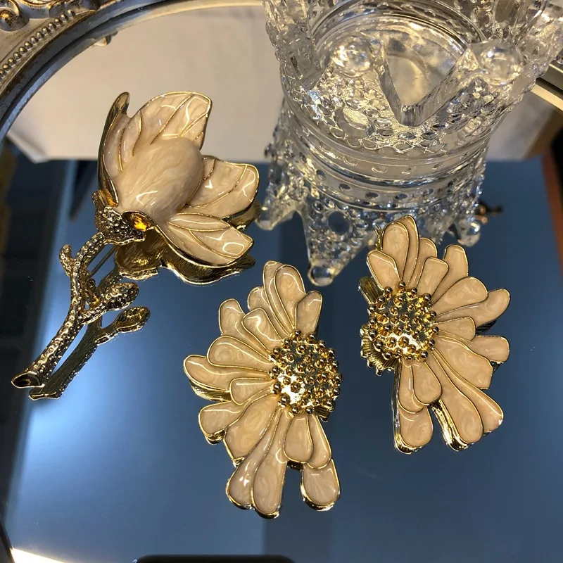 Middle aged white magnolia flower brooch earrings