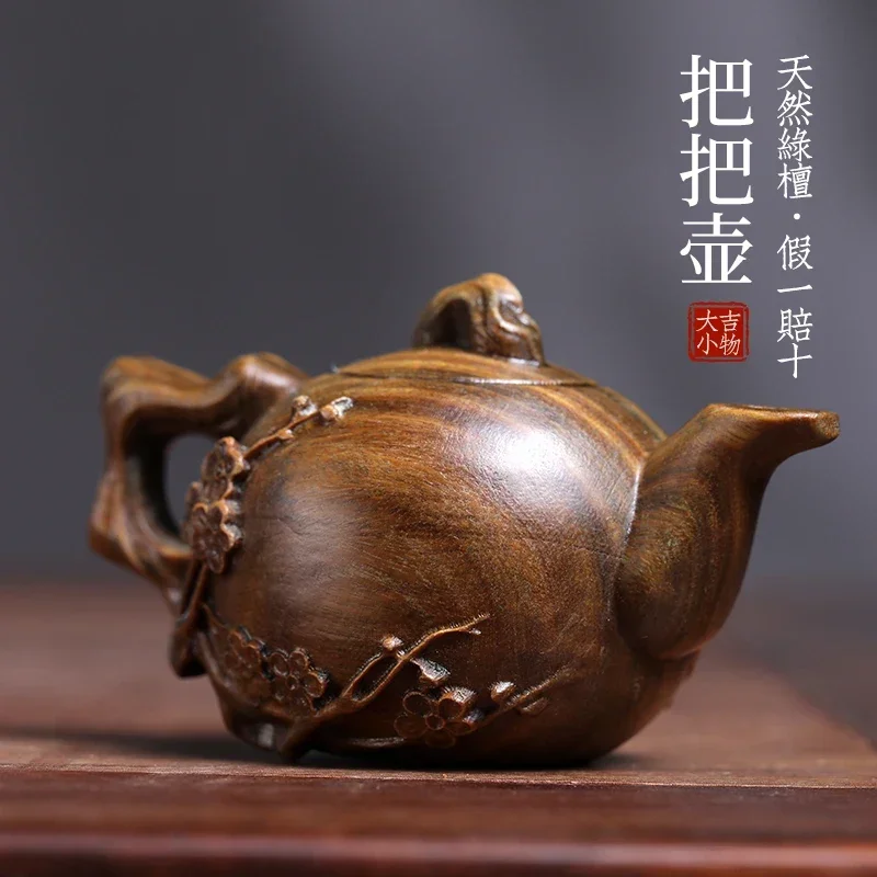 

Natural green sandalwood plum blossom handle pot wood carving handle ornament Wenwan log carving tea pet small ornament