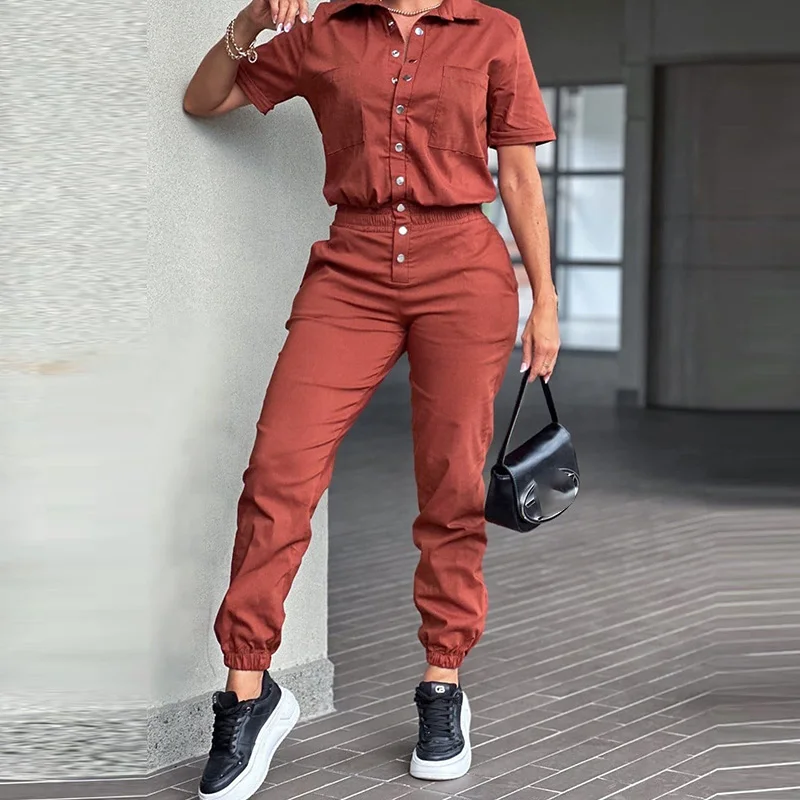 Elegante playsuits met revers en korte mouwen Chique elastische rompertjes met meerdere zakken High Street Fashion Effen jumpsuits met enkele rij knopen