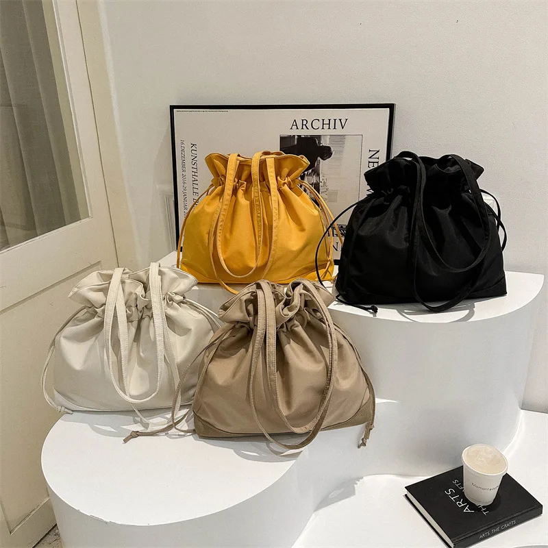 

New Japanese and Korean Oxford cloth large capacity solid color fashionable casual drawstring pleated bucket shoulder bag