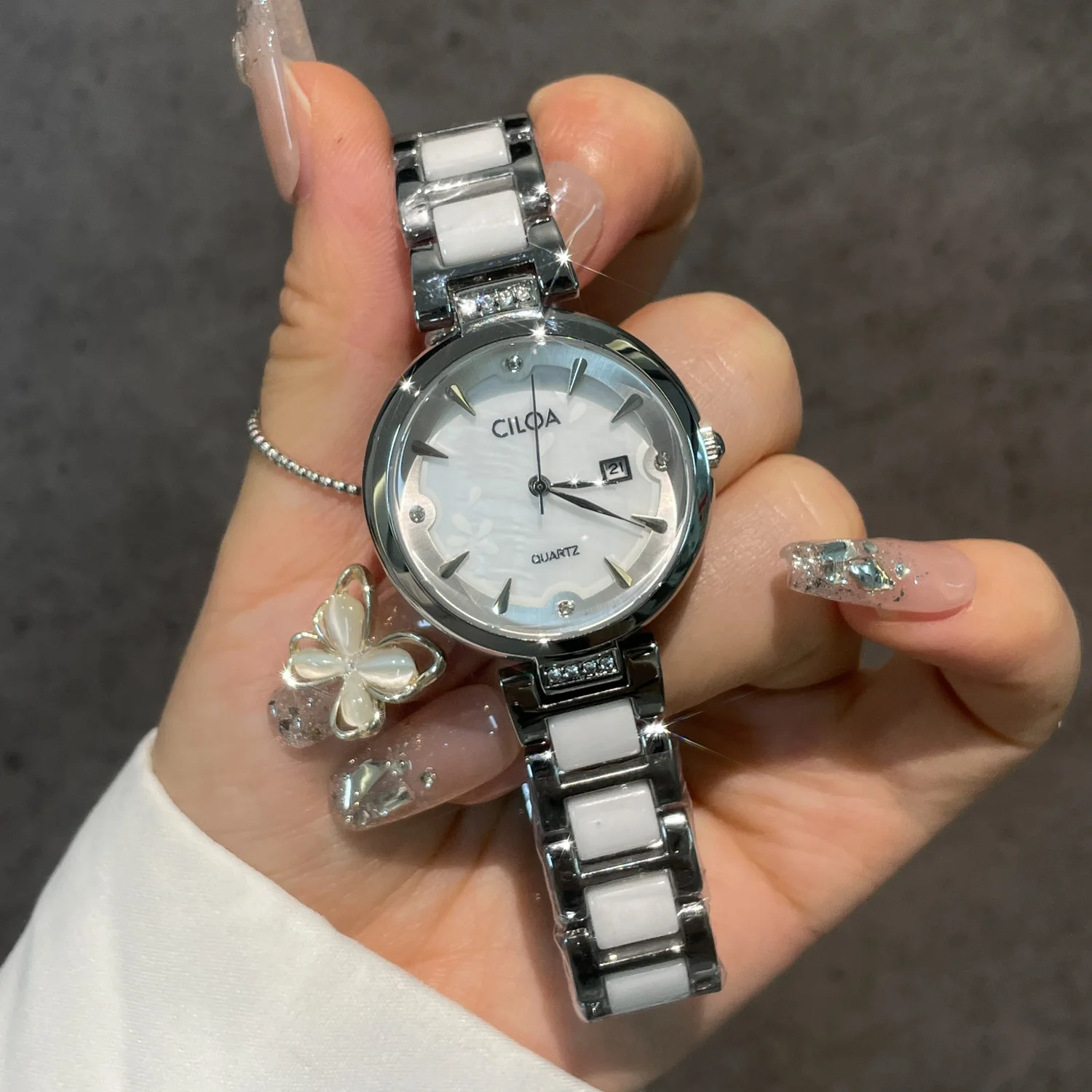 CILOA Elegant Womens Quartz Watch Embossed Floral White Dial Date Window Rhinestone Inlaid Ceramic Steel Mixed Bracelet Daily Wristwatch