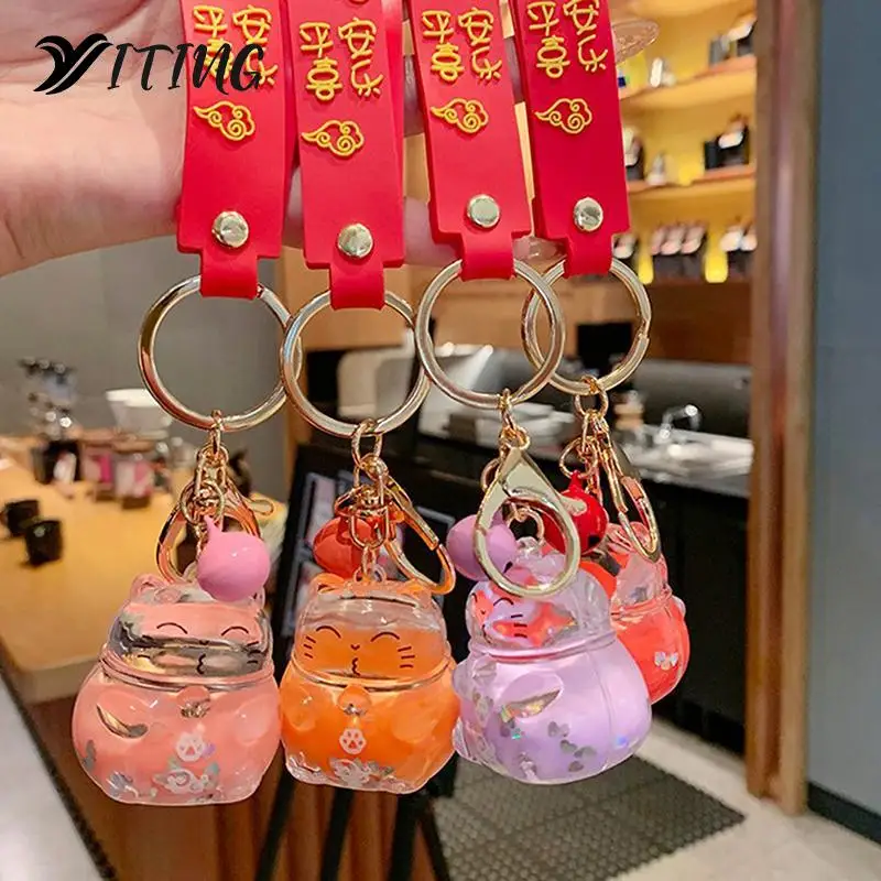 1pcs Cute Maneki keychain Neko Lucky Cat Liquid Crystal Quicksand Rubber Wristband Keychain Key Chain For Women Bag Pendent