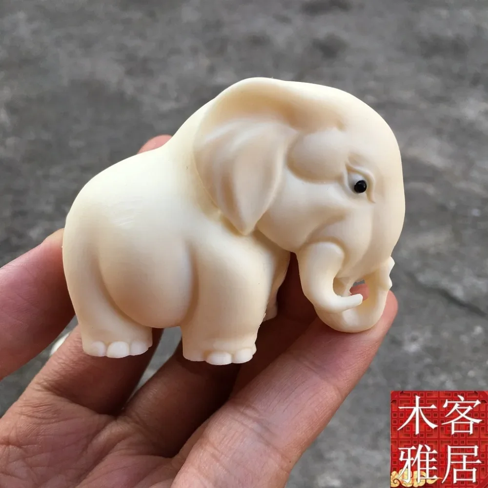 

Изысканная декоративная фигурка орнамента слона цвета слоновой кости ручной работы