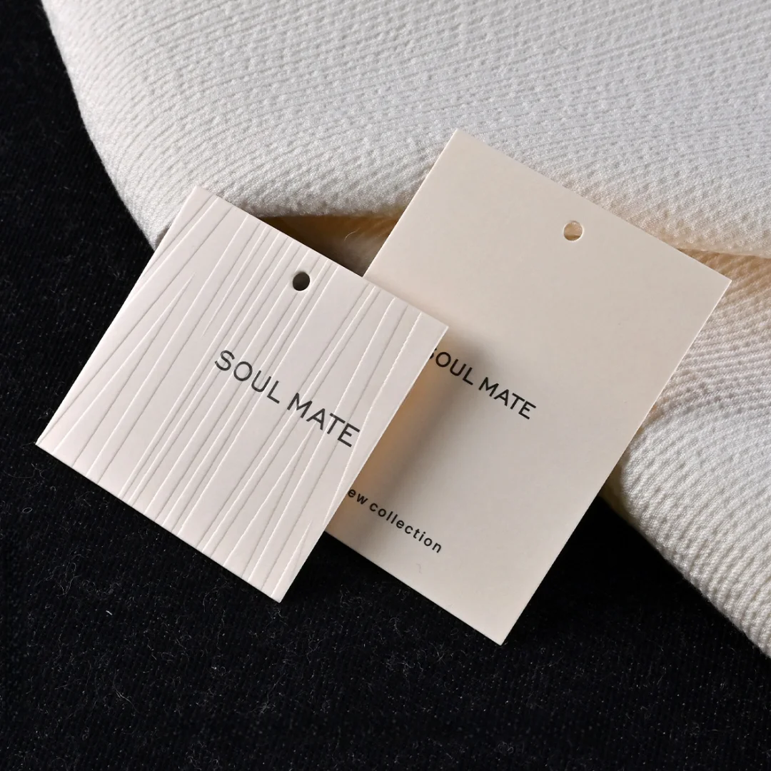 

Wholesale Custom Embossed Logo Paper Tags, Eco-Friendly Special Texture Hang Tags for Clothing, Shoes & T-Shirts