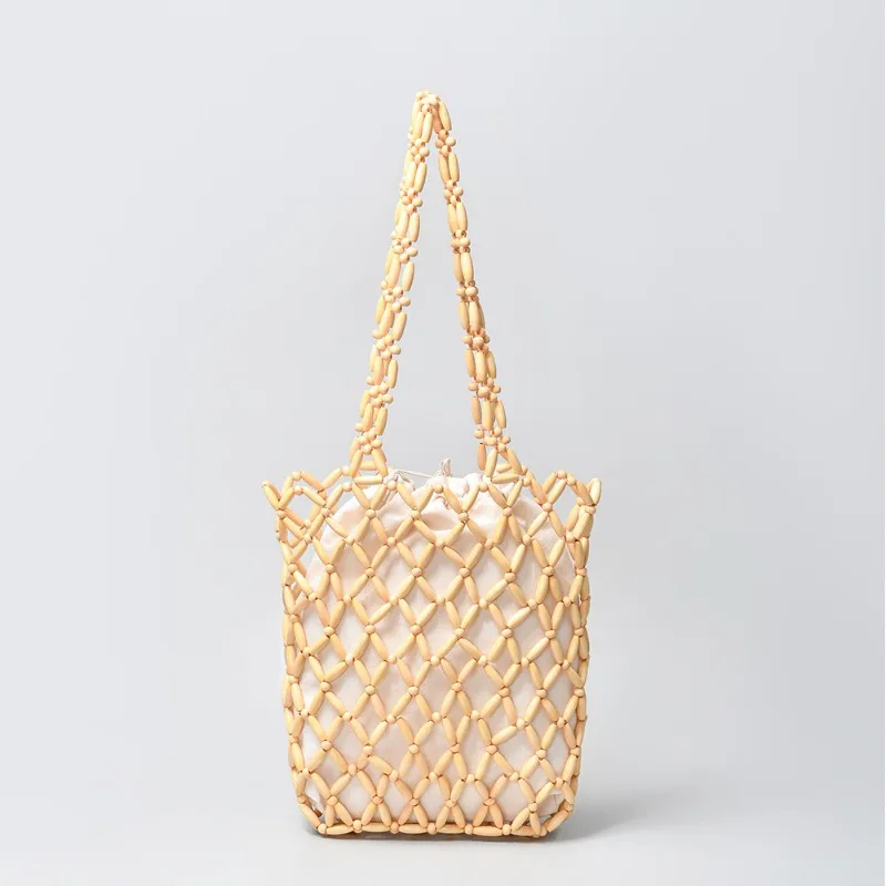 

Casual Beach Bags Women Bohemia Hollow Out Fashion Tote Bags with Lining Casual Wood Beads Travel Shoulder Bolsas Feminina
