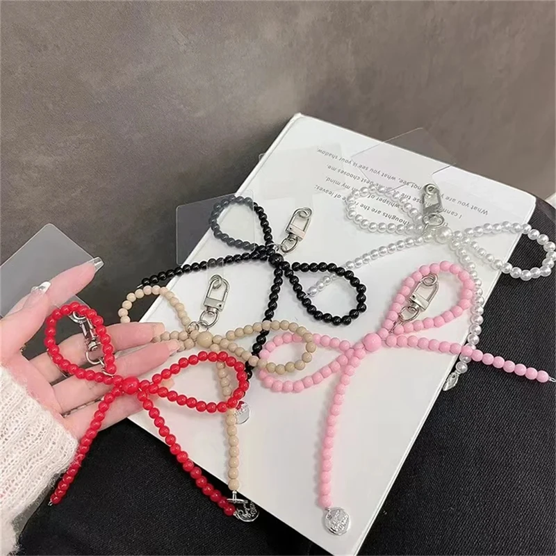 

Корейские милые розовые жемчужные бусины в форме банта, подвесные телефонные цепочки, эстетичные Подвесные Брелки для iPhone, Samsung, аксессуары для девочек, оптовая продажа
