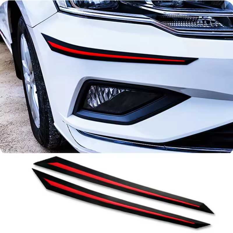 Applying the adhesive front bumper protector to a sedan corner.