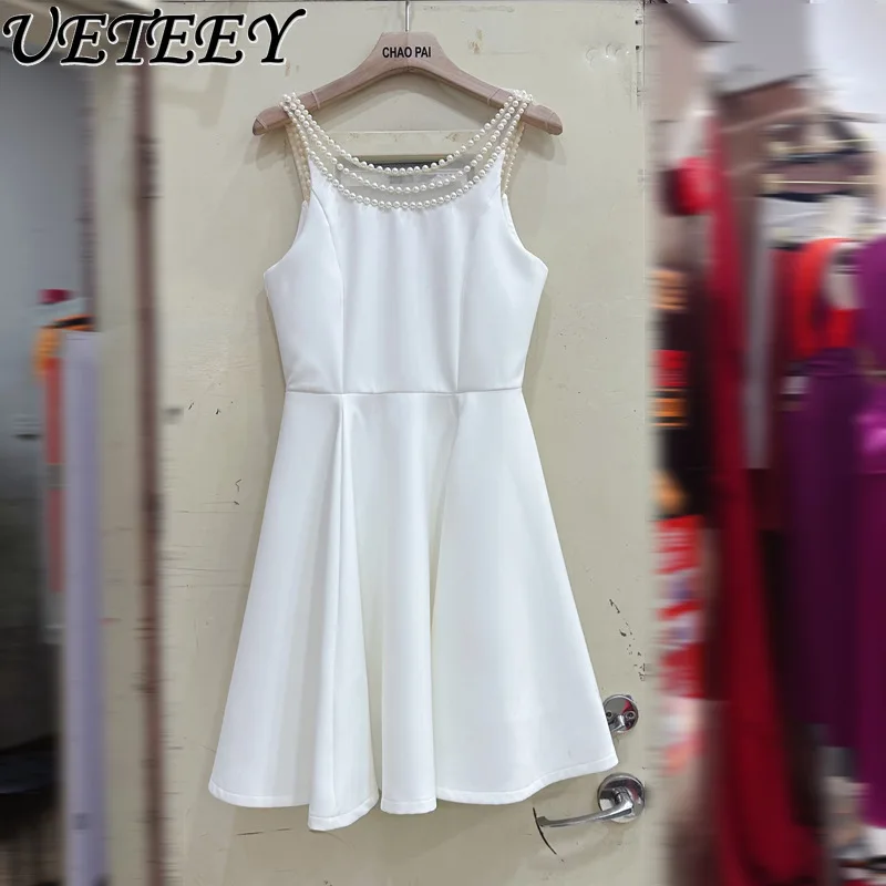 Europejska i amerykańska francuska gwiazda z temperamentem perłowa sukienka na szelkach letnie krótkie sukienki z wysokim stanem i odkrytymi plecami